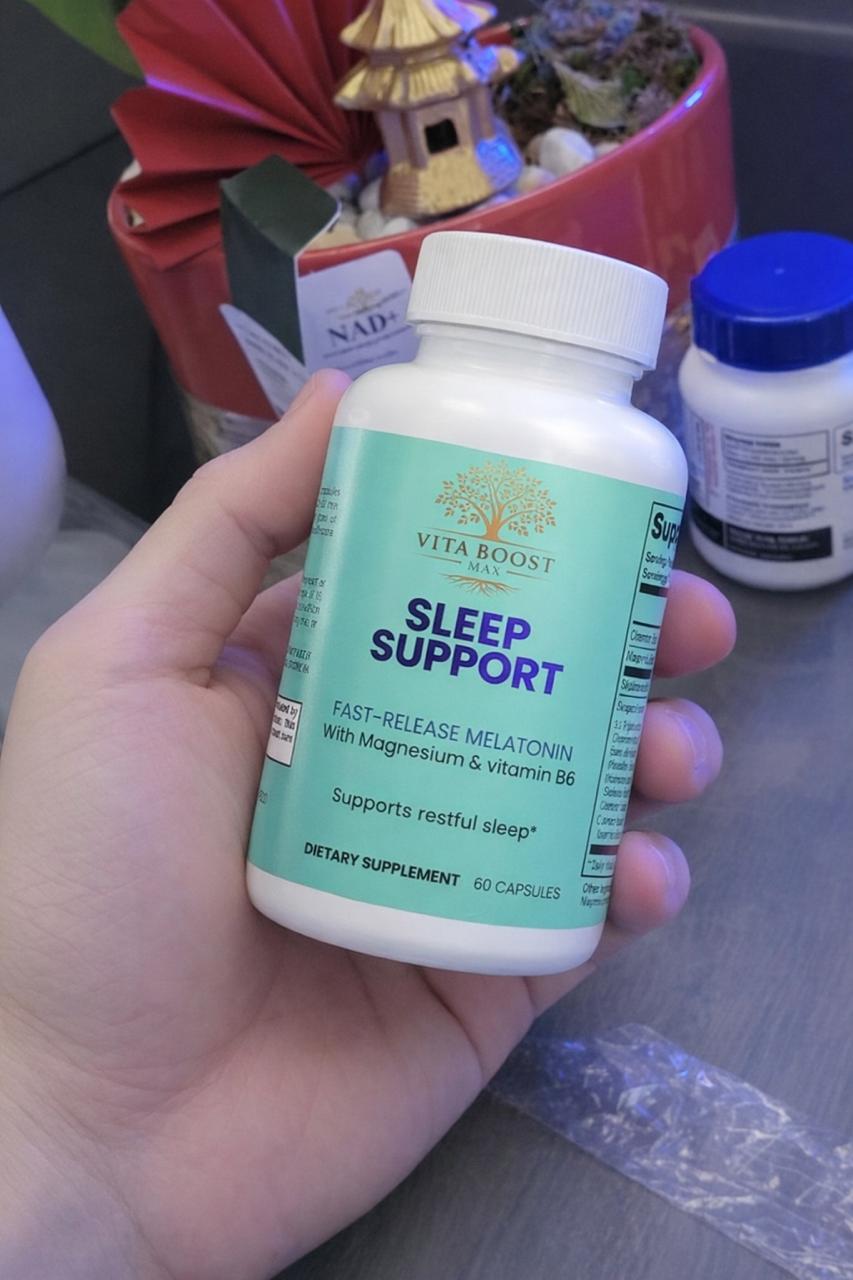 A customer holding Vita Boost Max Sleep Support in a home setting, showcasing the supplement's bottle and its natural calming formula with Magnesium and B6.